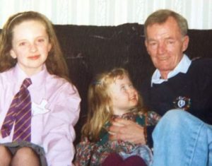 A Childhood Picture of Abbey With Her Sister and Grandfather