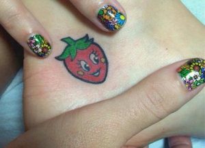 Katy-Perry's-Strawberry-tattoo