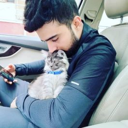 Adil Khan Durrani with his cat and car