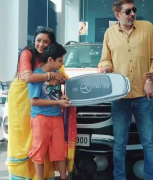 Rupali Ganguly poses with her family and Mercedes Benz