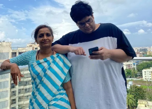 Tanmay Bhat standing with his mother