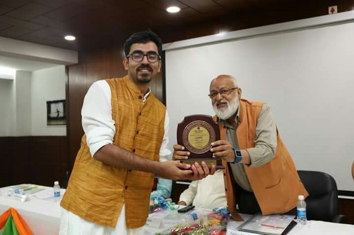 Pranjal Kamra receiving award
