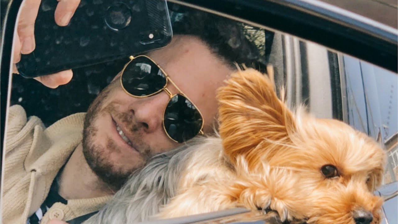 Kerem Bürsin with his pet dog in car - clicking selfie